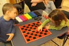 Daniel and Anya playing Checkers